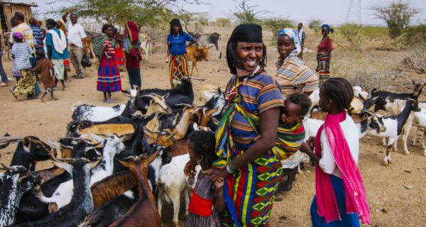 Woman with children and little goats