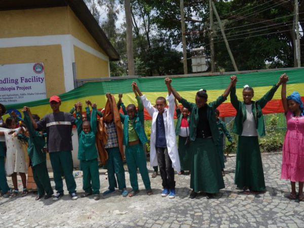 Children and teachers holding hands