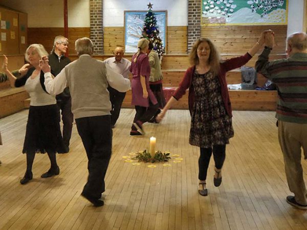 SPANA fundraiser Hilary Brown taking part in a circle dance with others.