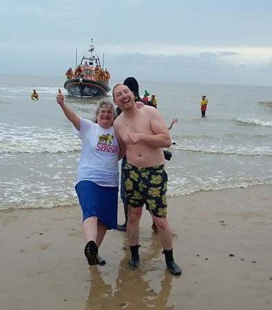 Janet Wicking and family on beach after Christmas Day swim.