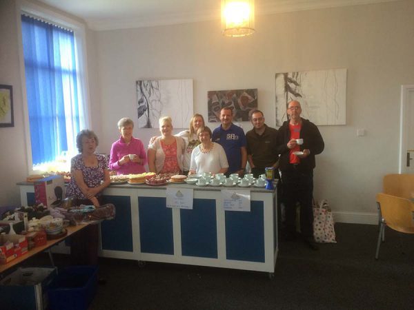 Group of people having a coffee morning
