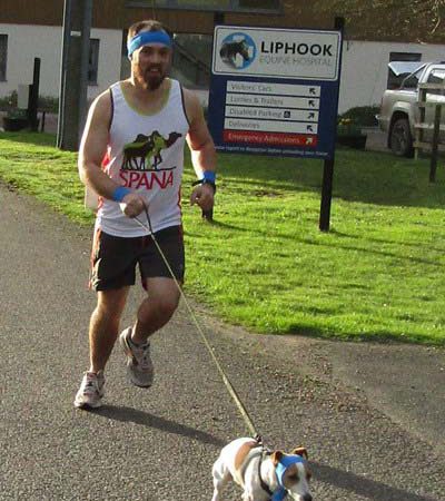 Man running with dog