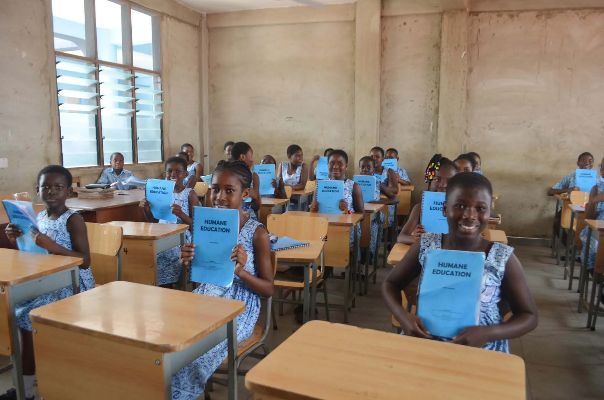Children in a classroom sat behind desks