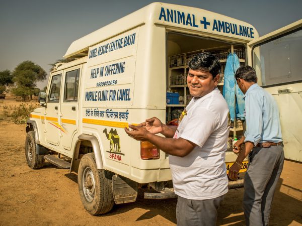 Vet next to the mobile clinic