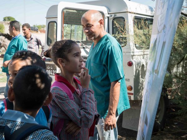 young girl learns animal welfare