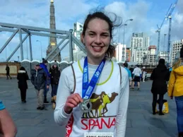 Abbie shows off her marathon medal