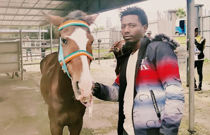 Bula the horse with his owner, Ameha.